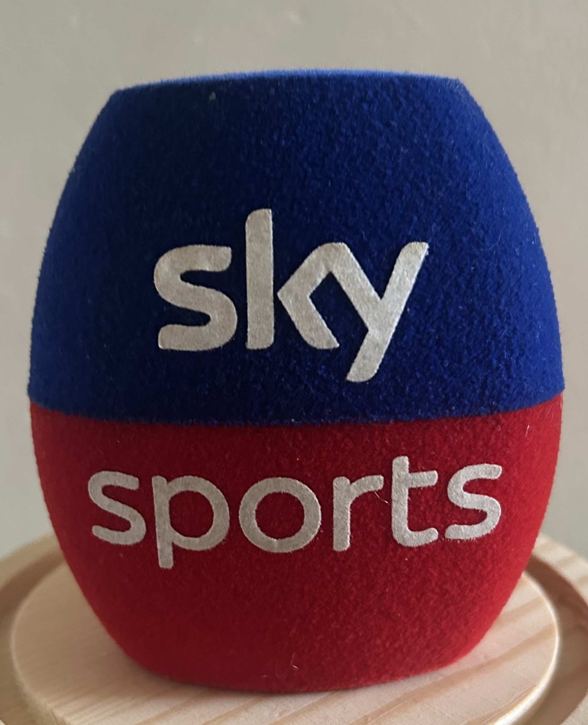 A blue and red sky sports microphone cover.