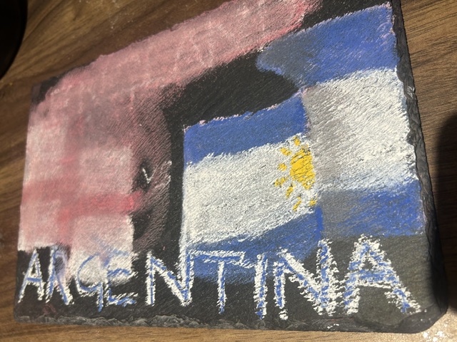 Fucking Argies - Again (chalk board with England rubbed out).